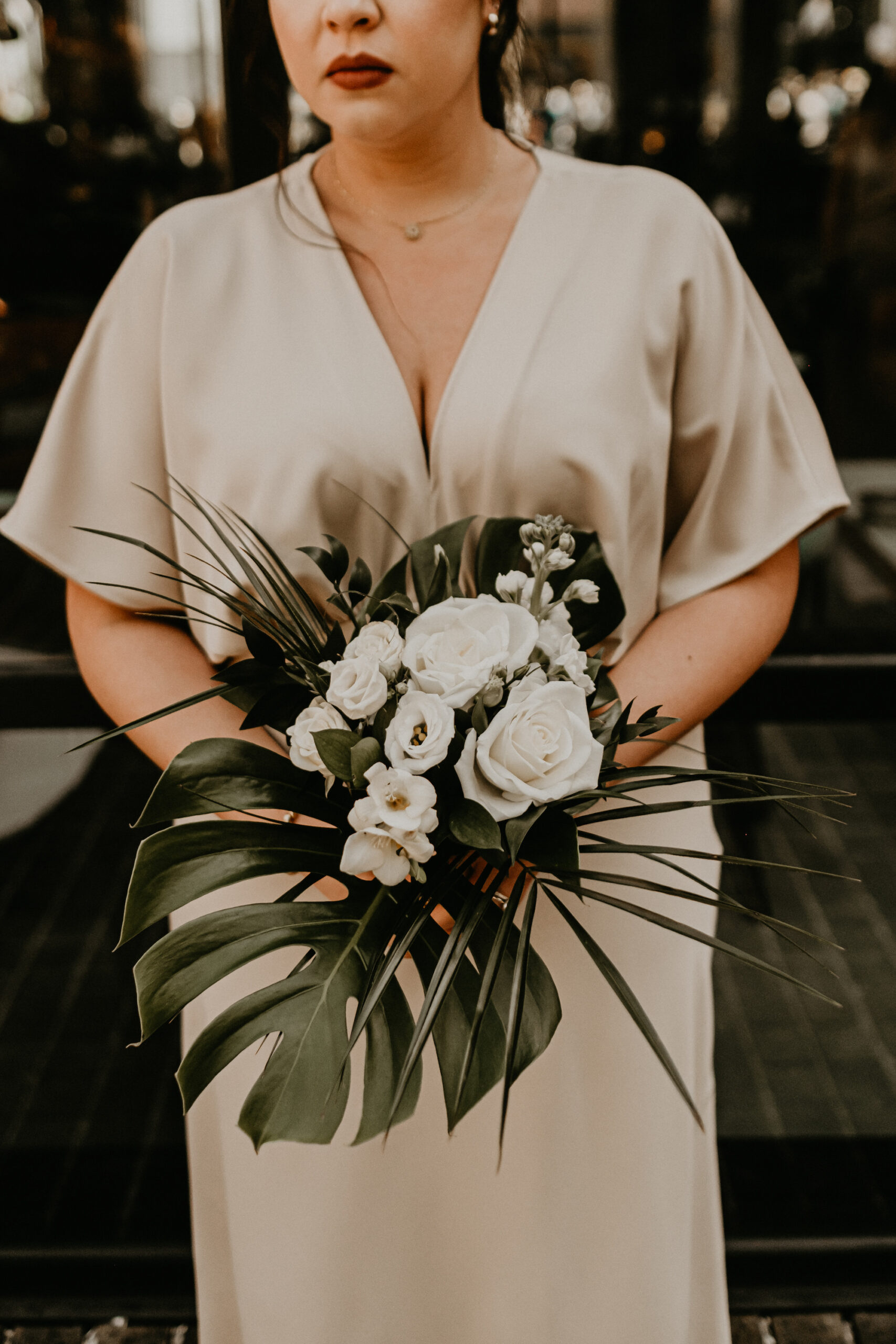 Mismatched Bridesmaids Neutral Champagne Wedding Dresses | Modern Tropical Bridal Party Wedding Inspiration | White Roses and Tropical Greenery Bouquets | Tampa Bay Florist Monarch Events and Design