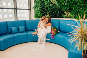 Vibrant Colorful Same Sex Wedding, Brides First Look Wedding Portrait | Waterfront Wedding Venue Hilton Clearwater Beach