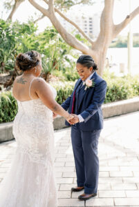 Vibrant Same Sex Lesbian Wedding, Bride Wearing Blue Suit First Look with Bride Wedding Portrait | Tampa Bay Wedding Photographer Dewitt for Love | Wedding Hair and Makeup Imago Dei by Milan
