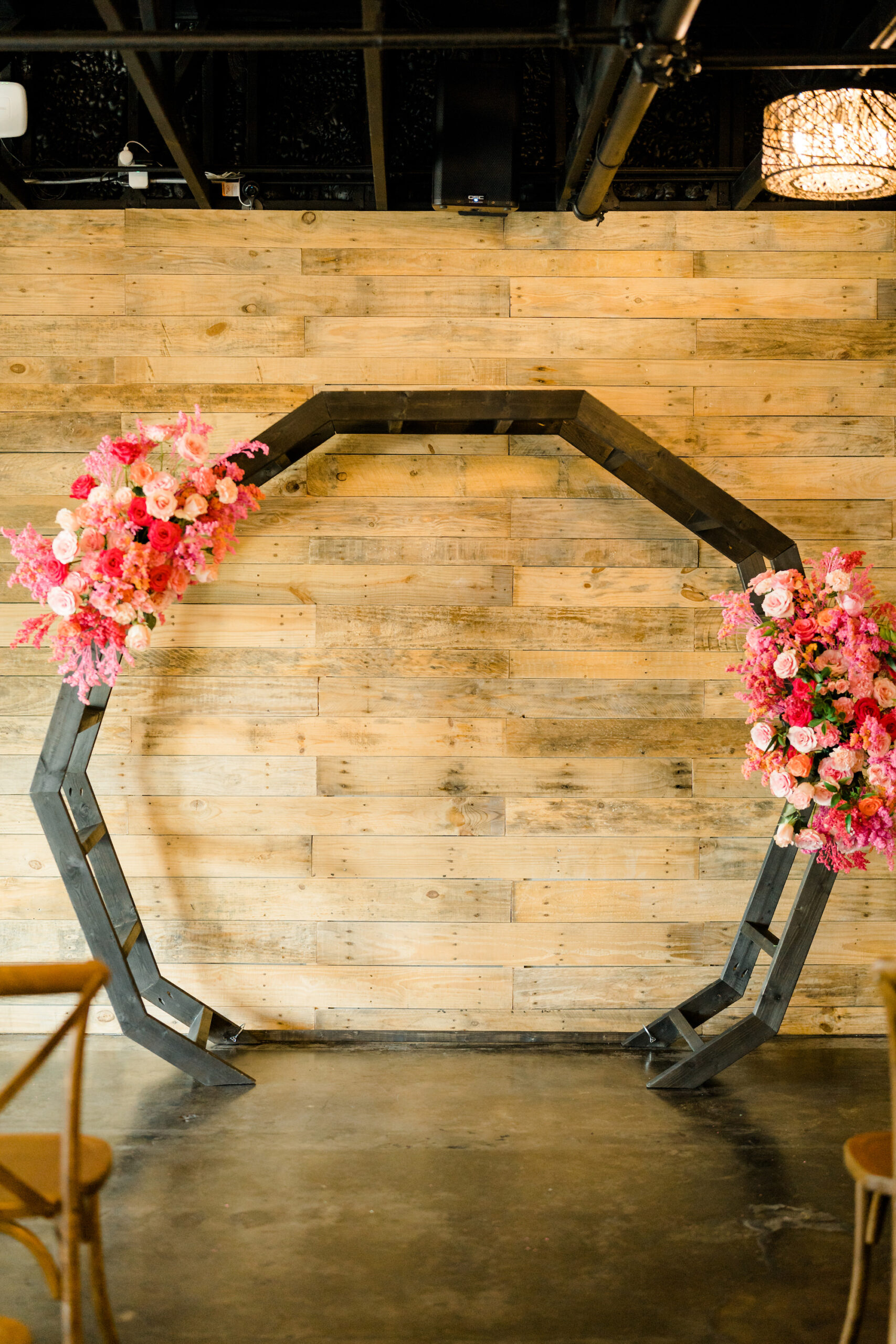 Rustic Boho Wedding Ceremony Decor, Black Geometric Arch with Lush Pink and Fuchsia Flower Arrangements | St. Pete Beach Wedding Venue The West Events