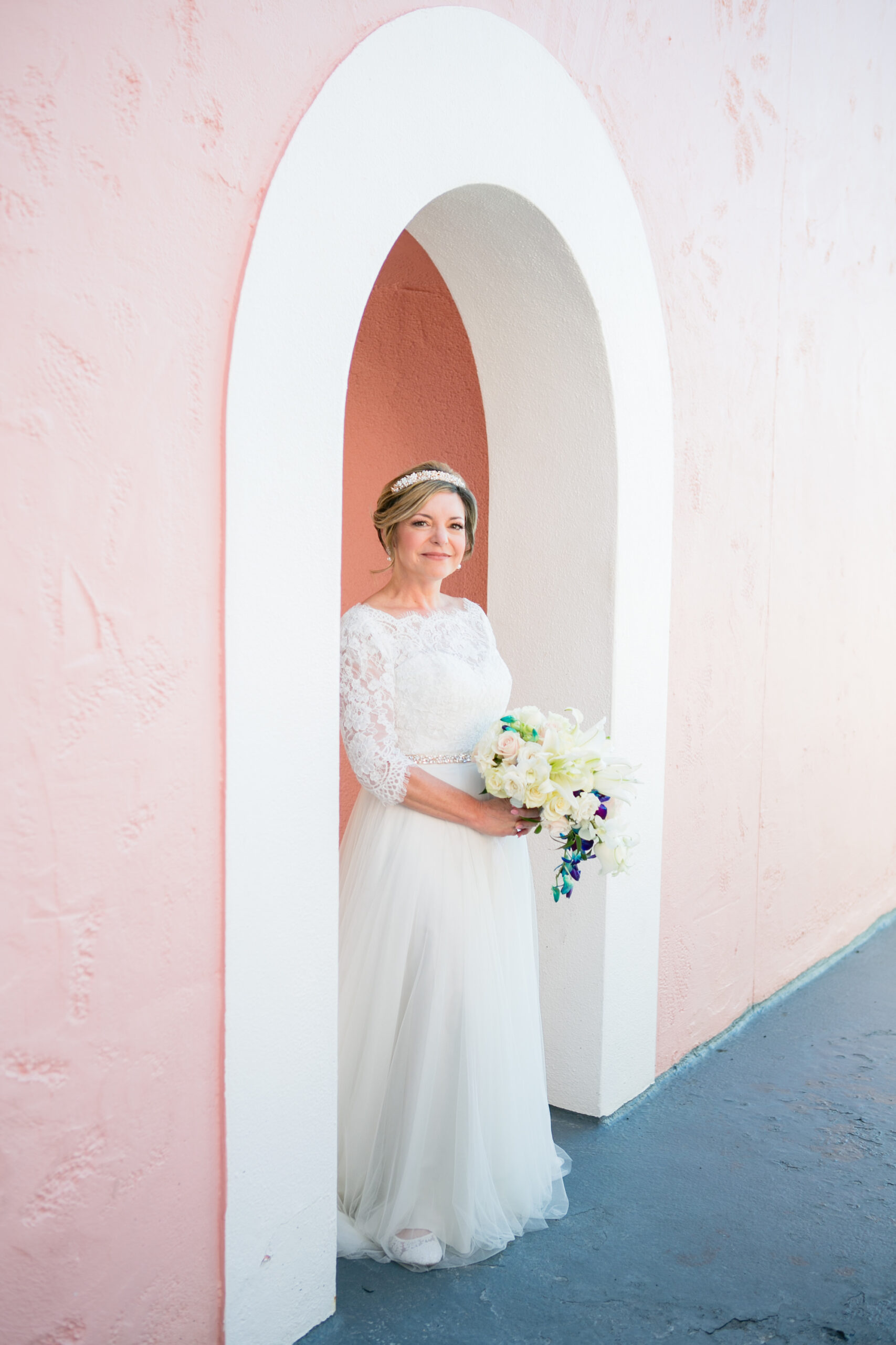 Classic Bride Wearing Lace Half Sleeve Bodice and Tulle Skirt Wedding Dress Holding White Roses and Blue Floral Bouquet | Tampa Bay Wedding Photographer Carrie Wildes Photography | Wedding Hair and Makeup Adore Bridal