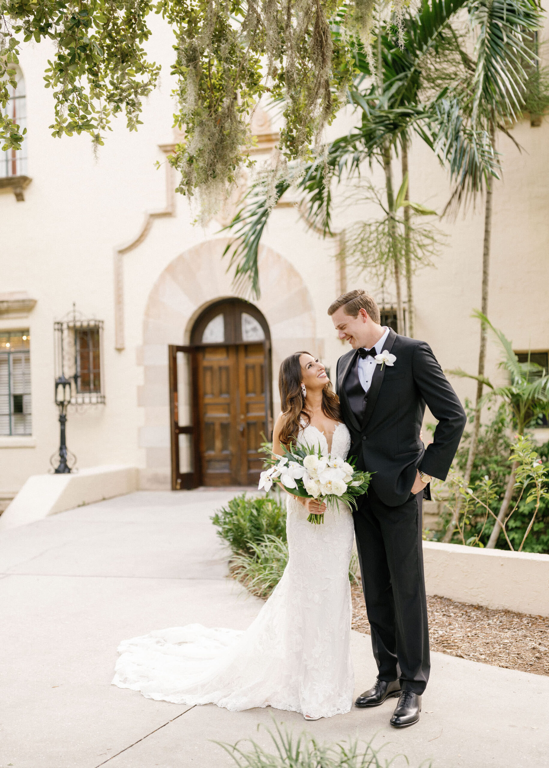 Luxurious Classic Bride and Groom in Black Tuxedo Wedding Portrait | St. Pete Wedding Venue Powel Crosley Estate | Tampa Bay Wedding Florist Botanica International Design Studio