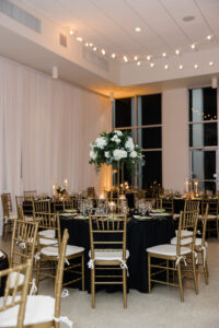 Gold Black and Greenery Wedding Decor with Gold Chiavari Chairs | NYE Wedding Decor at Tampa Garden Club