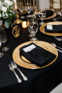 Gold Black and Greenery Wedding Decor with Gold Charger Plates and Black Napkins | NYE Wedding Decor