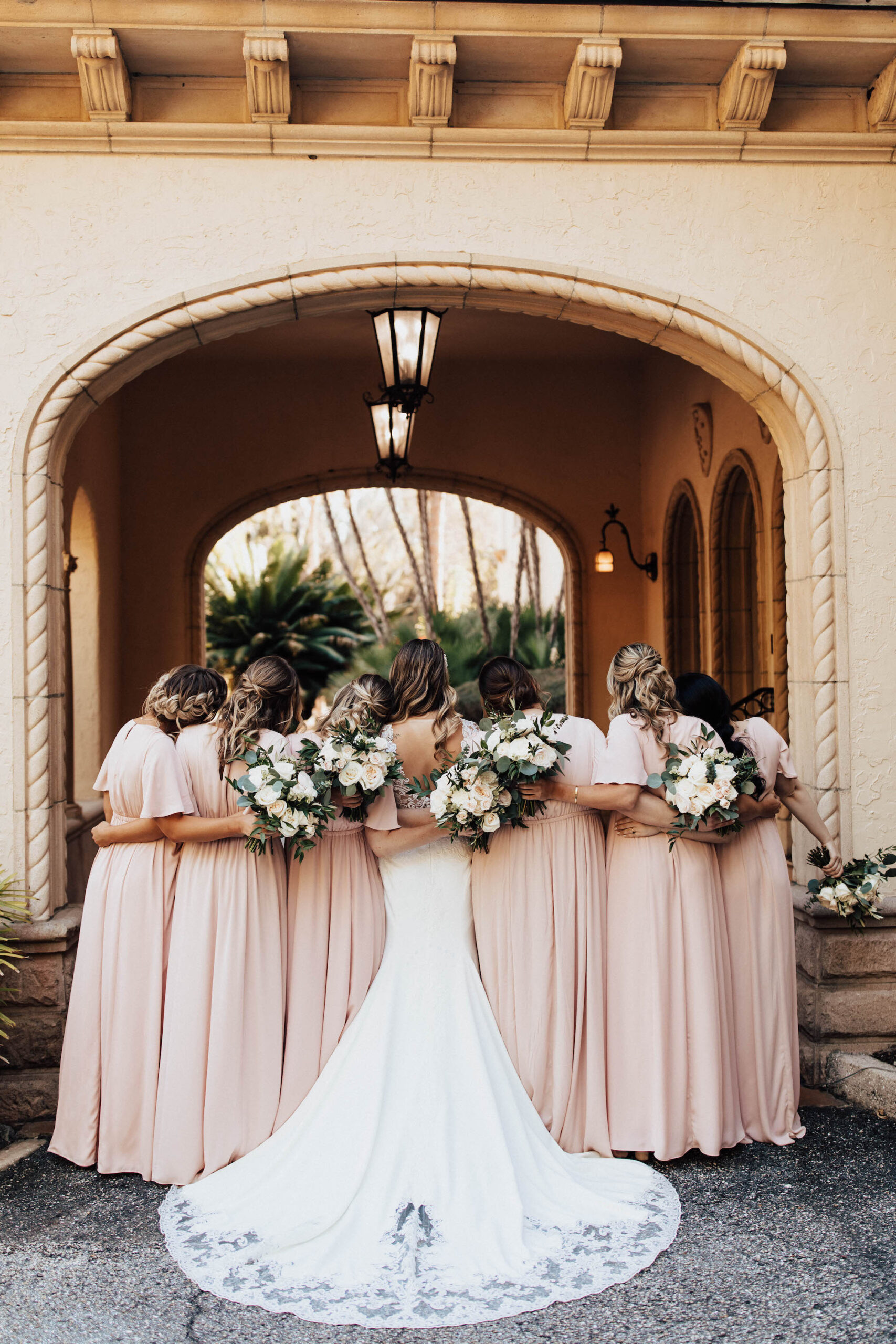 Bride and Bridesmaids in Blush Floor Length Wedding Dresses and White Floral Bouquets | Sarasota Hair and Makeup Artist Femme Akoi