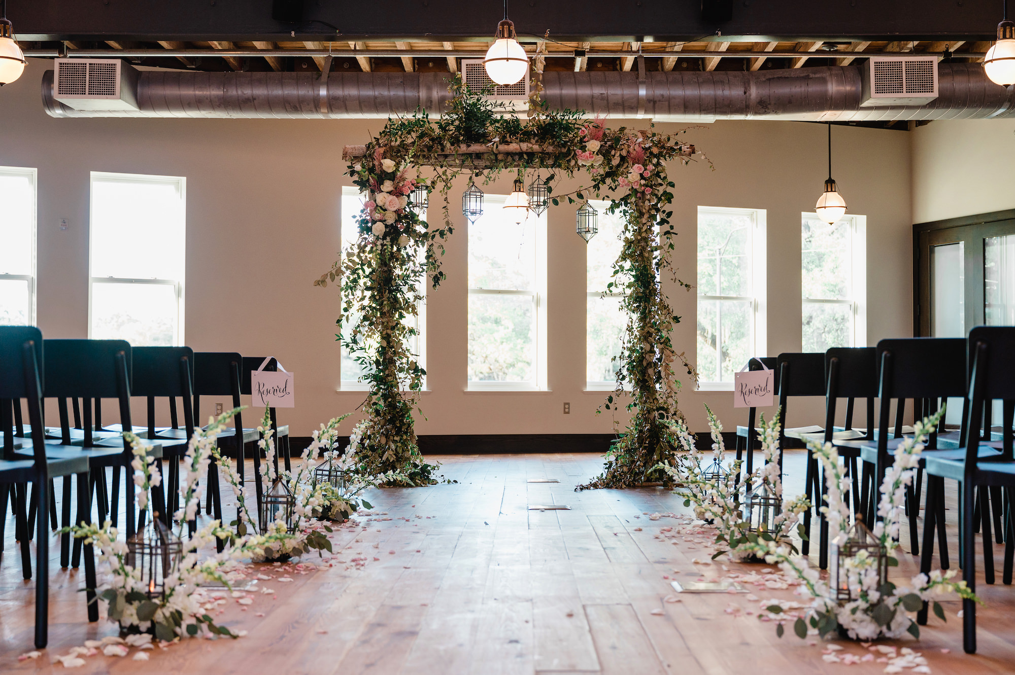 Indoor Spring Garden Wedding Ceremony Ideas | Blush Pink Rose and Greenery Wedding Arch And Aisle Floral Arrangements