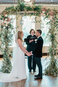 Indoor Spring Garden Wedding Ceremony Ideas | Blush Pink Rose and Greenery Wedding Arch And Aisle Floral Arrangements