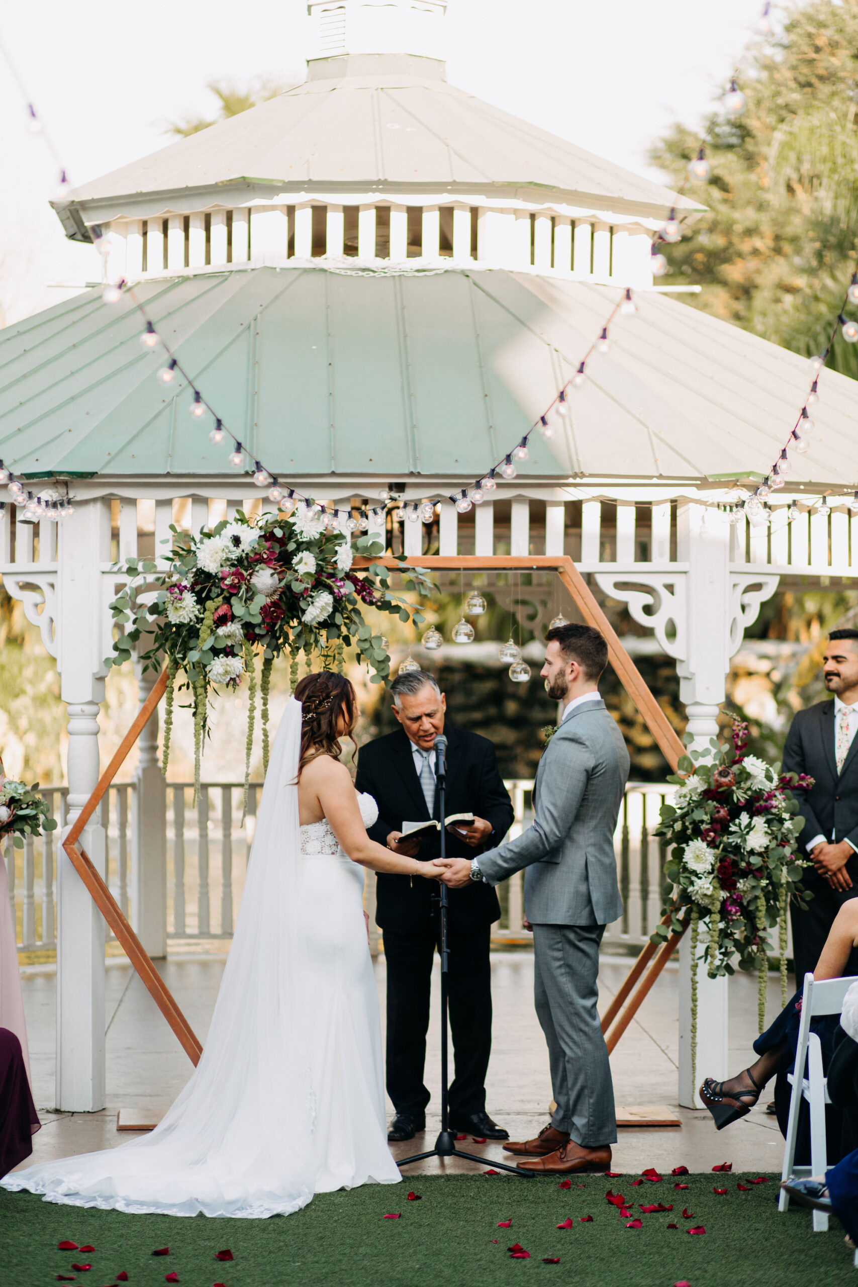 Outdoor Wedding Ceremony Gazebo with Geometric Hexagon Wooden Arch | Bohemian Flowers and Market Lights | Sarasota Wedding Venue The Pavilion at Mixon Farms