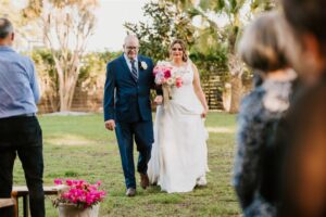 Emotional Father and Bride Walking Down Ceremony Aisle Portrait