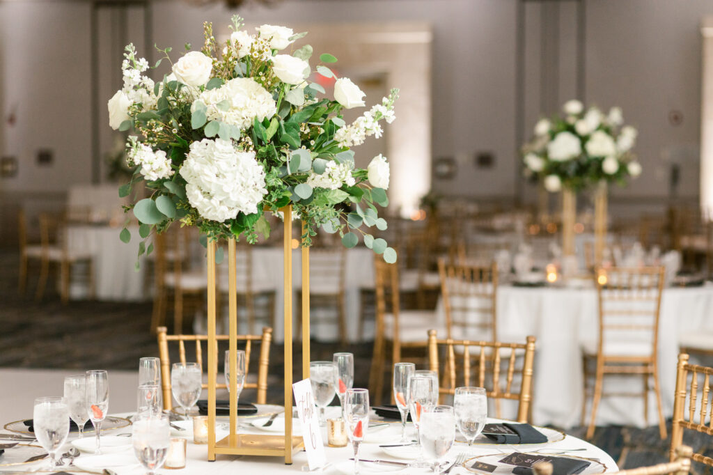 Classic Wedding Reception Decor, Tall Floral Centerpiece on Gold Rectangular Stand, Greenery with White Florals, Eucalyptus Leafs, Roses | Tampa Bay Wedding Florist Save The Date | Kate Ryan Event Rentals