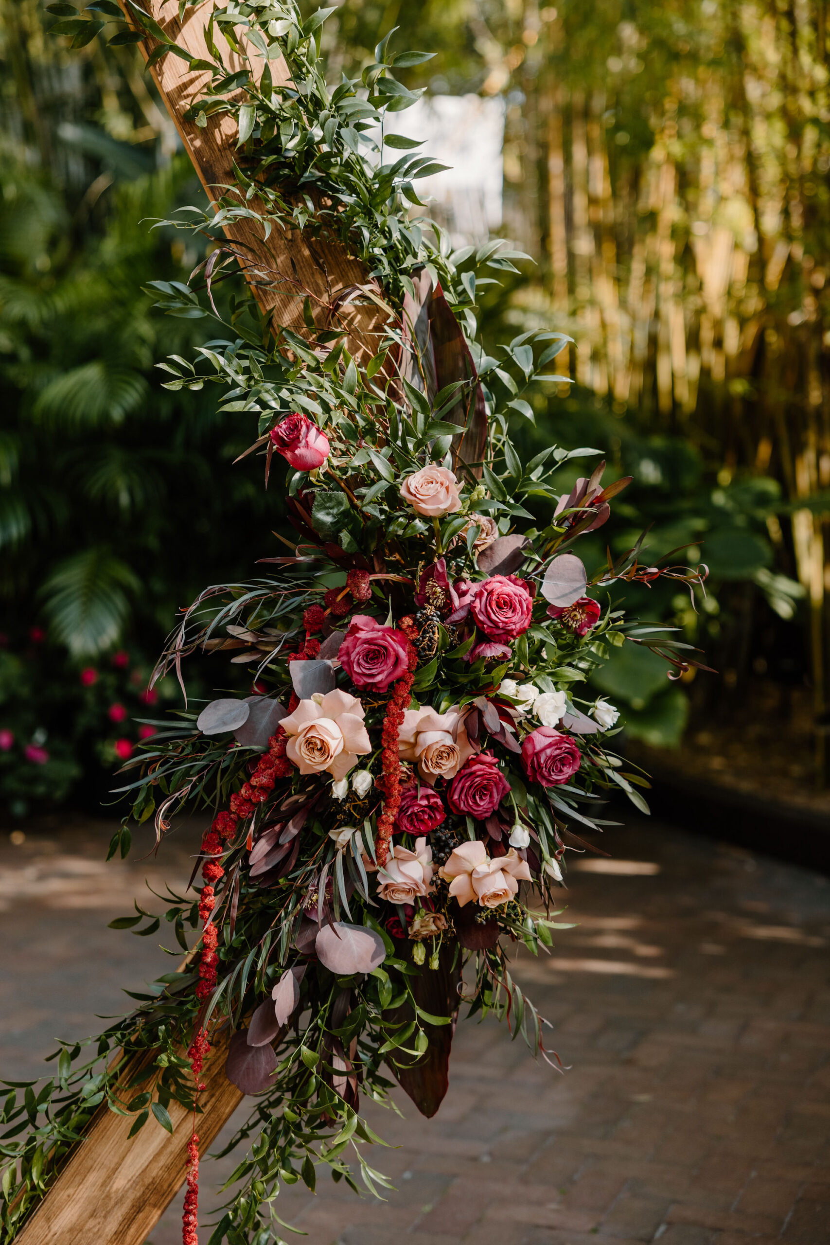 Red, Blush, White roses, and Greenery Gothic Wedding Ceremony Arch Floral Arrangement Inspiration