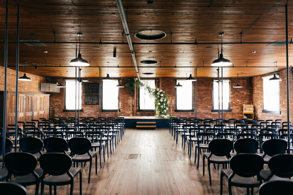 Modern Simplistic Wedding Ceremony | Asymmetrical Hydrangea and Greenery Wedding Arch | Tampa Bay Florist Bruce Wayne Florals | Ybor Venue JC Newman Cigar Company | Planner Parties a la Carte