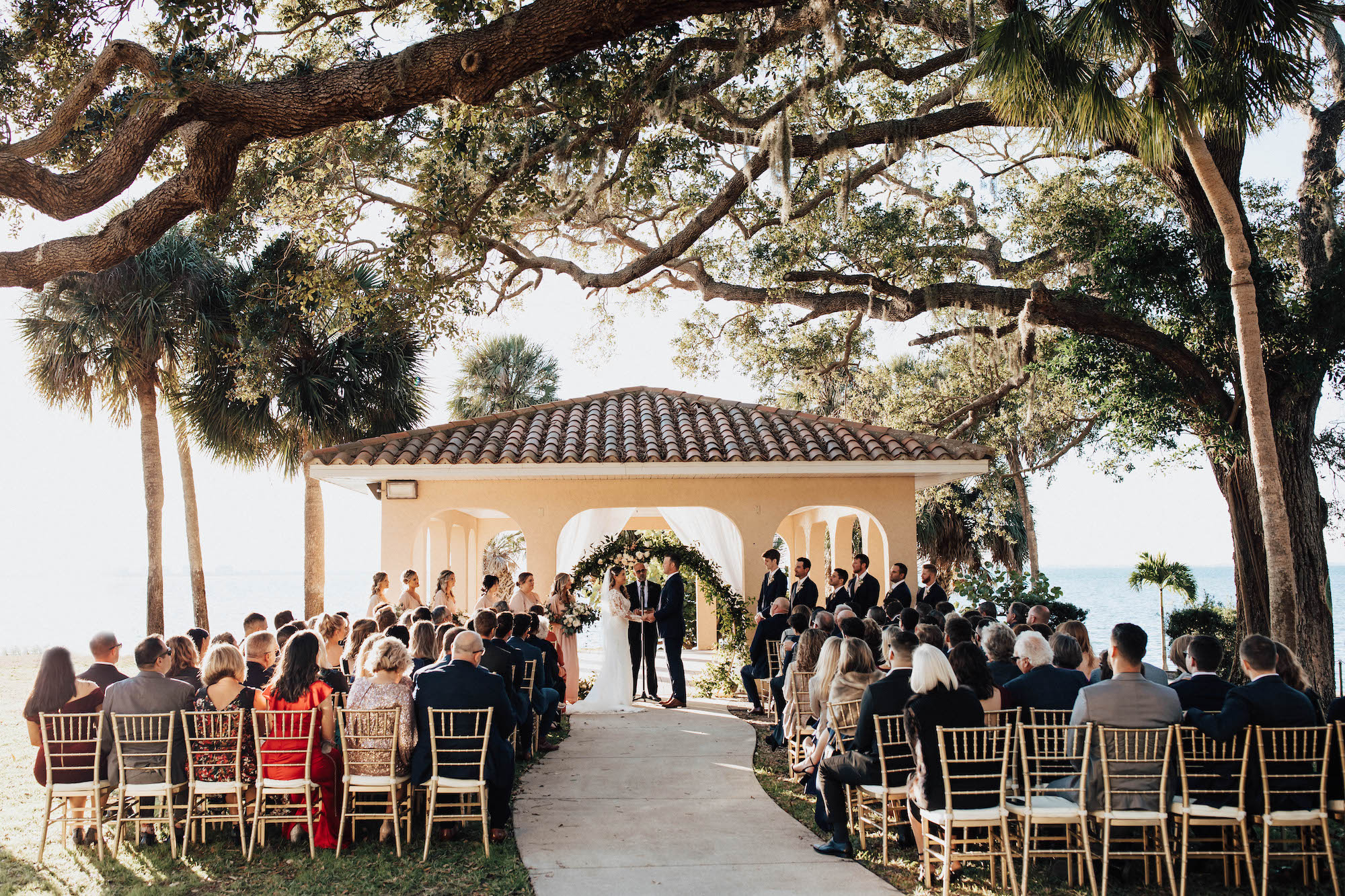 Bride and Groom Exchanging Vows in Outdoor Wedding Ceremony | Sarasota Wedding Planner Taylored Affairs | Venue Powel Crosley
