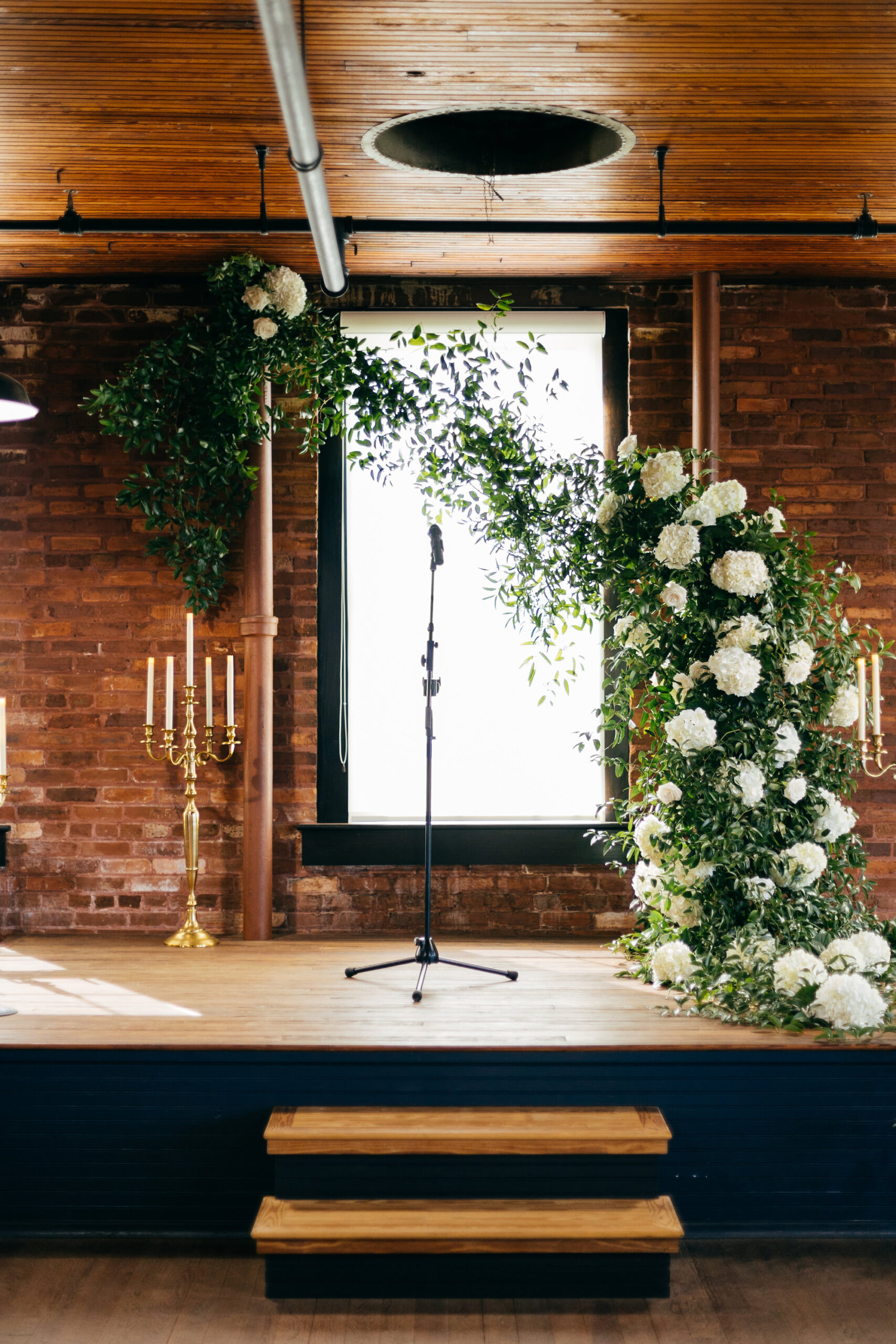 Whimsical White Hydrangea and Greenery Wedding Ceremony Arch With Gold Candelabra | Tampa Bay Florist Bruce Wayne Florals