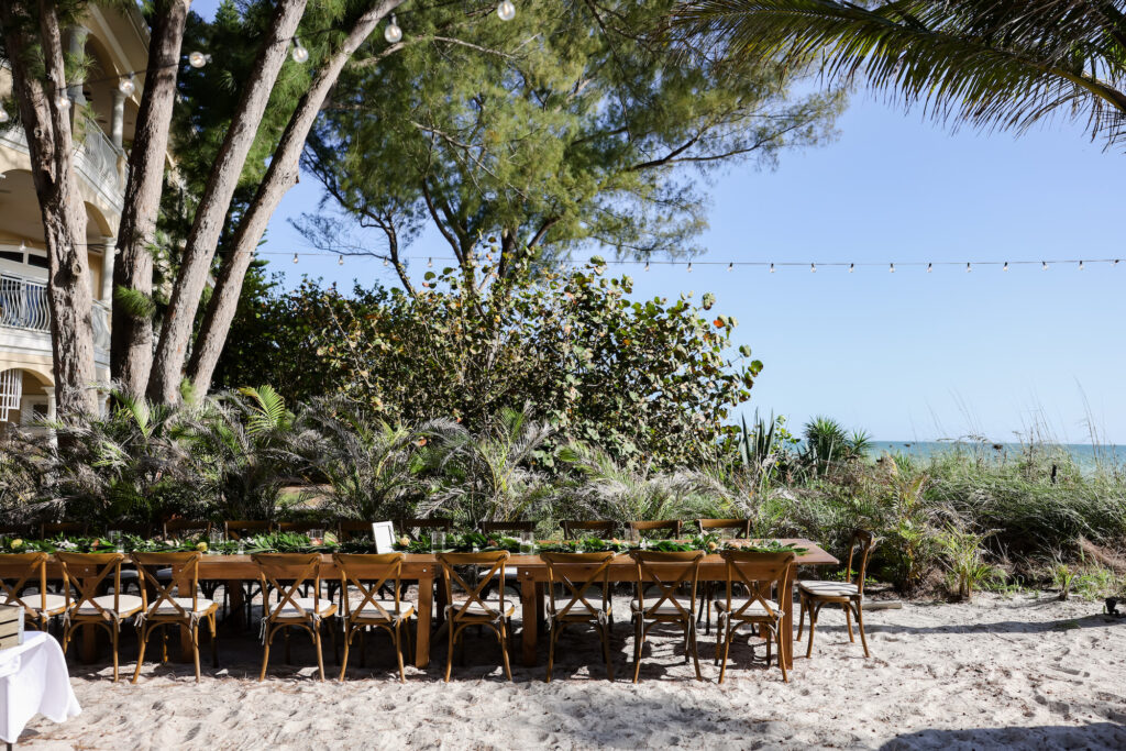 Long Feasting Beach Wedding Reception Tables | Wood Crossback Chairs | Tampa Bay Rentals Gabro Event Services