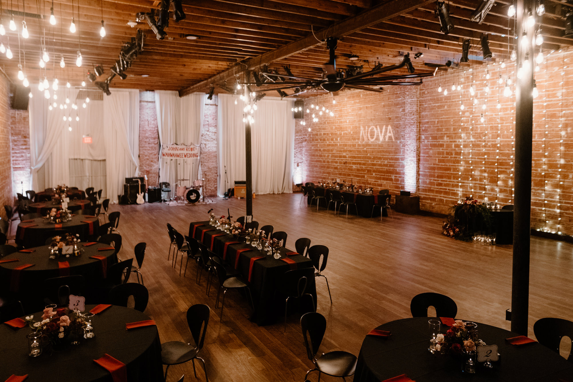 Industrial Wedding Reception with Black Modern Chairs | Long Feasting Tables | St. Pete Wedding Venue NOVA 535