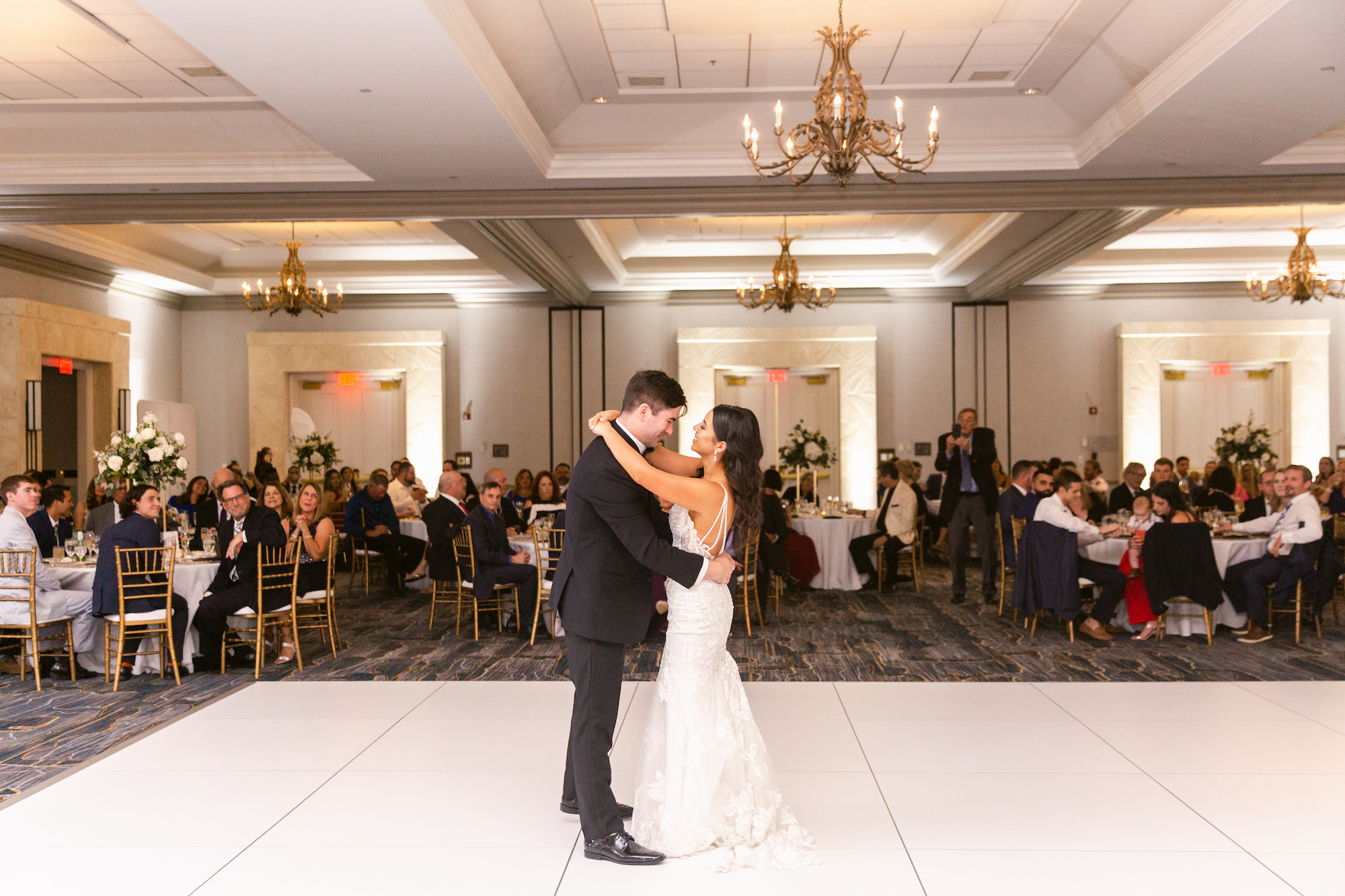 Classic Bride and Groom First Dance on White Dance Floor | Tampa Marriott Waterside Ballroom | Florida Wedding Planner EventFull Weddings