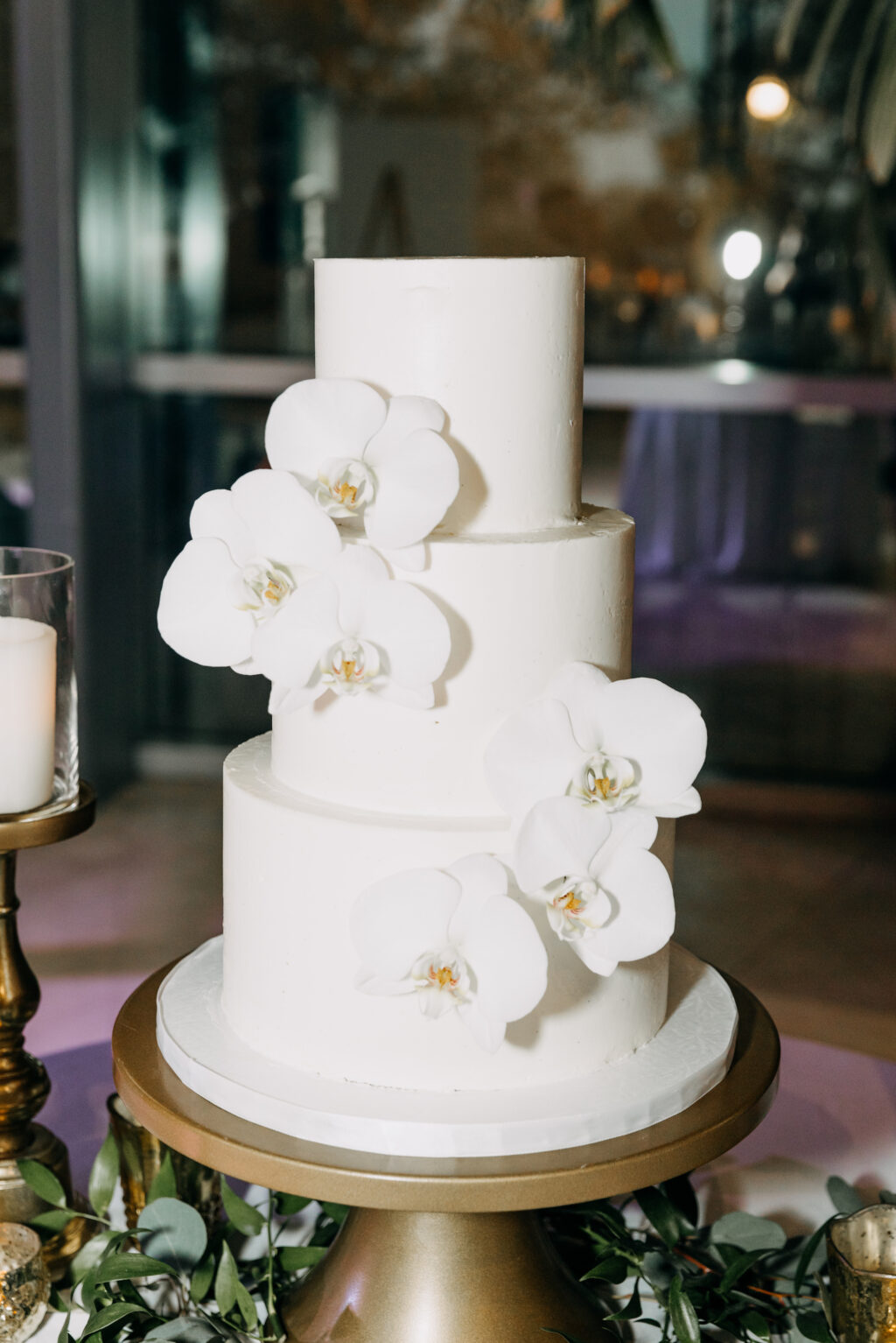 Classic White Three-Tiered Wedding Cake with White Orchid Flowers | Tampa Bay Cake Company