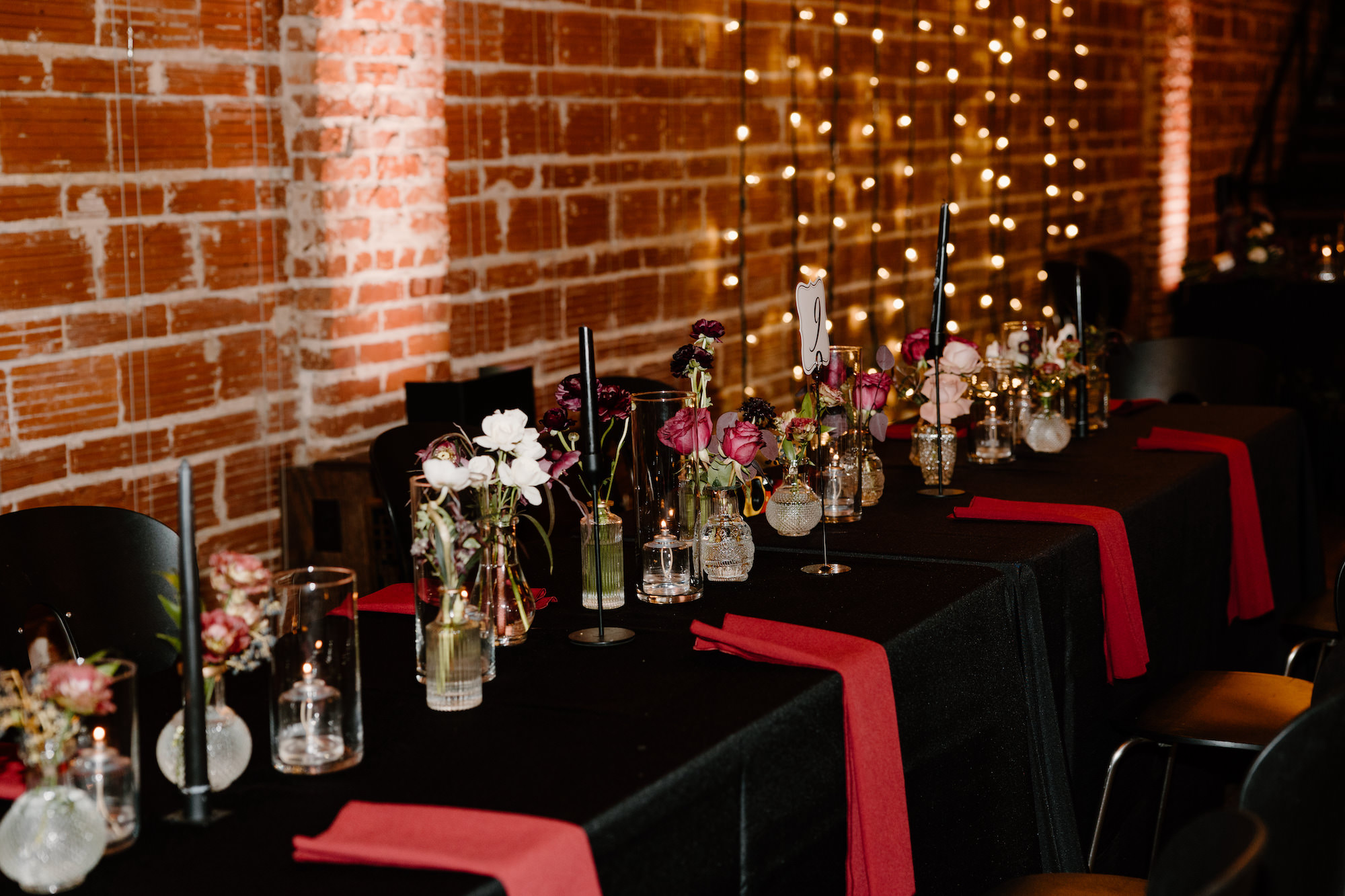 Dark and Moody and Gothic Pink and Black Table Linens for Long Feasting Tables | Black Taper Candles | Rose Centerpieces | St. Pete Wedding Venue NOVA 535