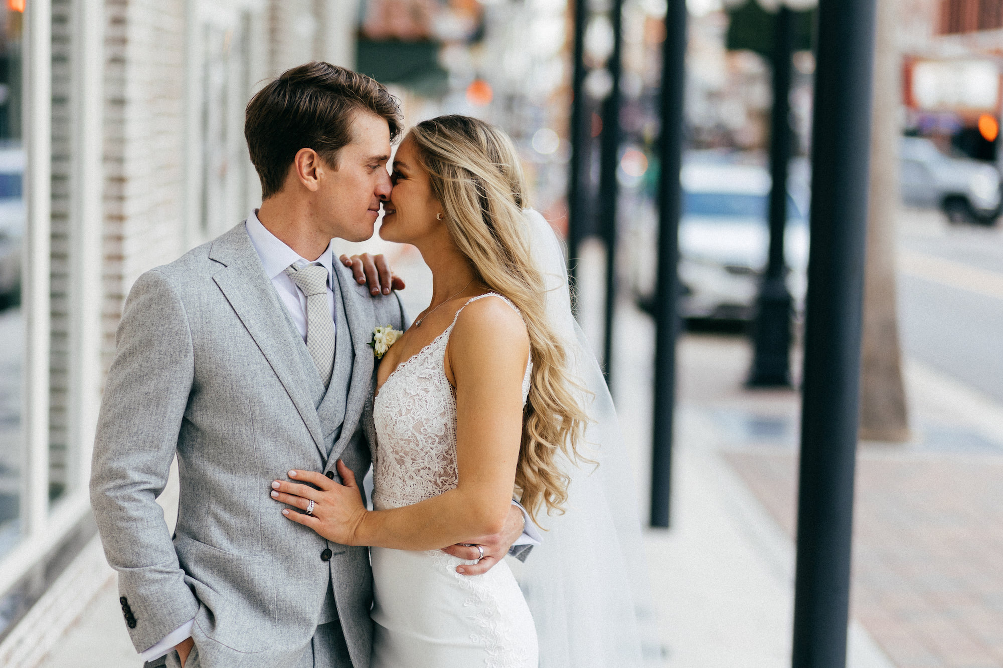 Tampa Bay Bride and Groom in Historic Ybor City, Light Gray Suit, Luna Novias Lace Overlay Wedding Dress