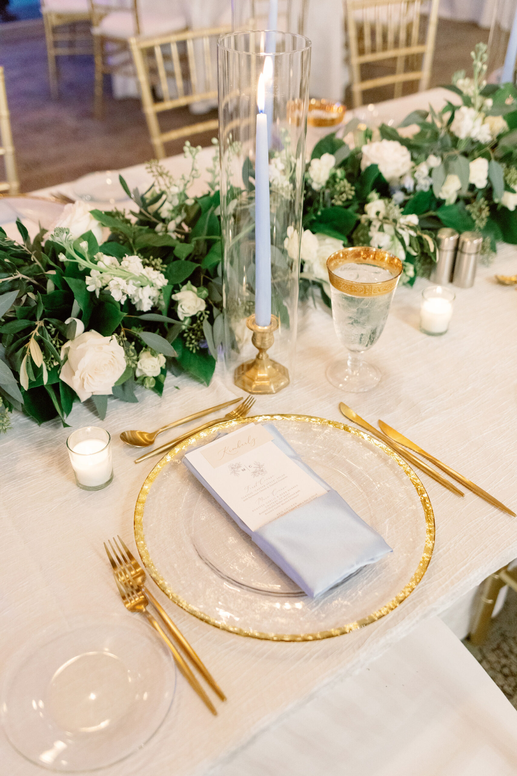 Candlelit Gold Wedding Table Setting with Gold Chargers and Flatware and Greenery Centerpiece | Romantic Classic Reception Decor Ideas