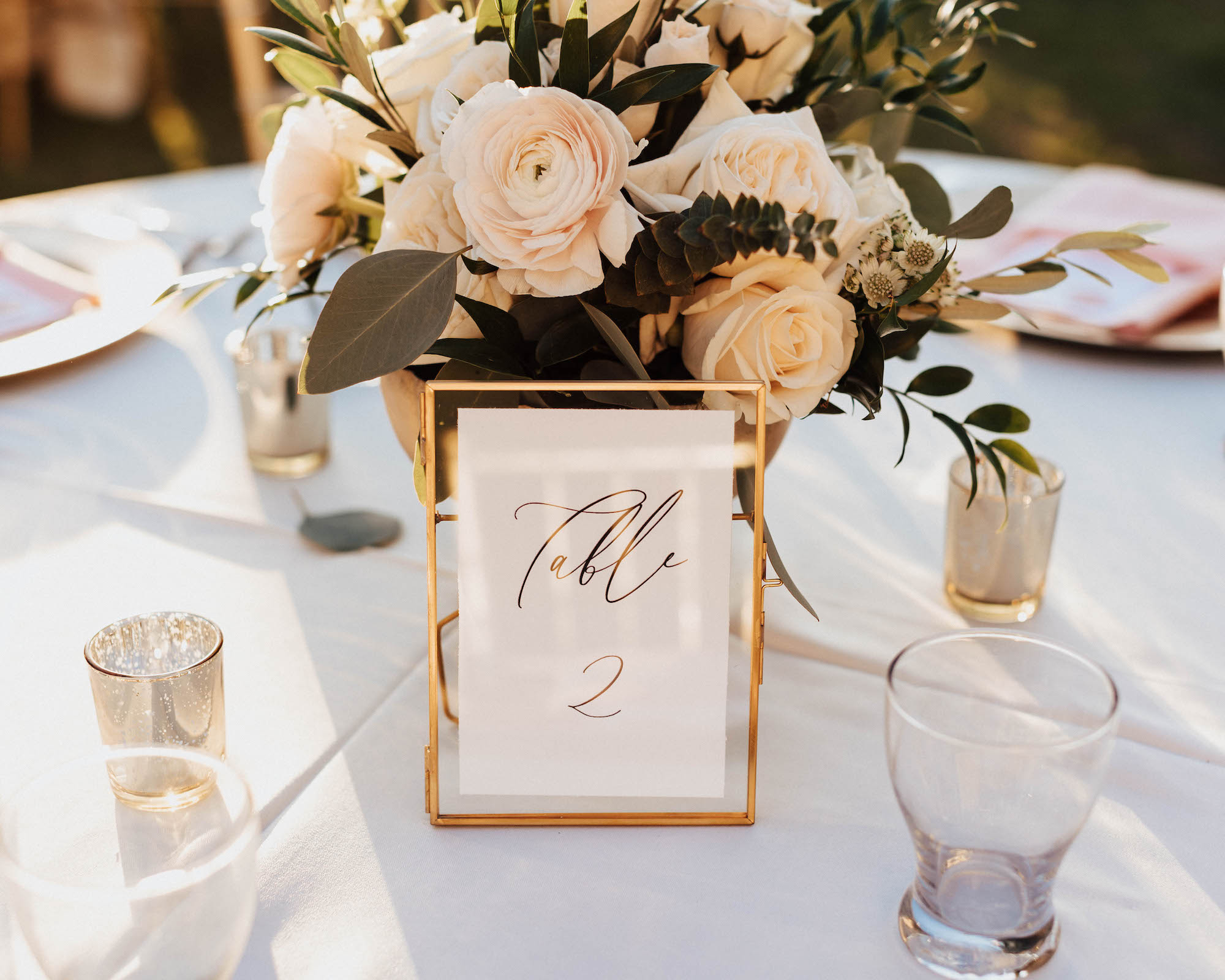 Gold Table Number with White Backing and Floral and Greenery Tablescape Centerpieces