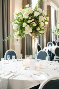 Classic Tall Gold Column Vases with White Roses and Snapdragon with Greenery Floral Centerpiece Ideas | Tampa Bay Florist Bruce Wayne Florals