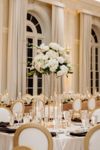 Elegant Tall Gold Flower Stand with White Hydrangeas, Roses and Greenery Wedding Reception Centerpiece Inspiration