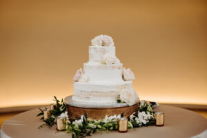 Three-Tiered Round Semi-Naked Wedding Cake with White Roses