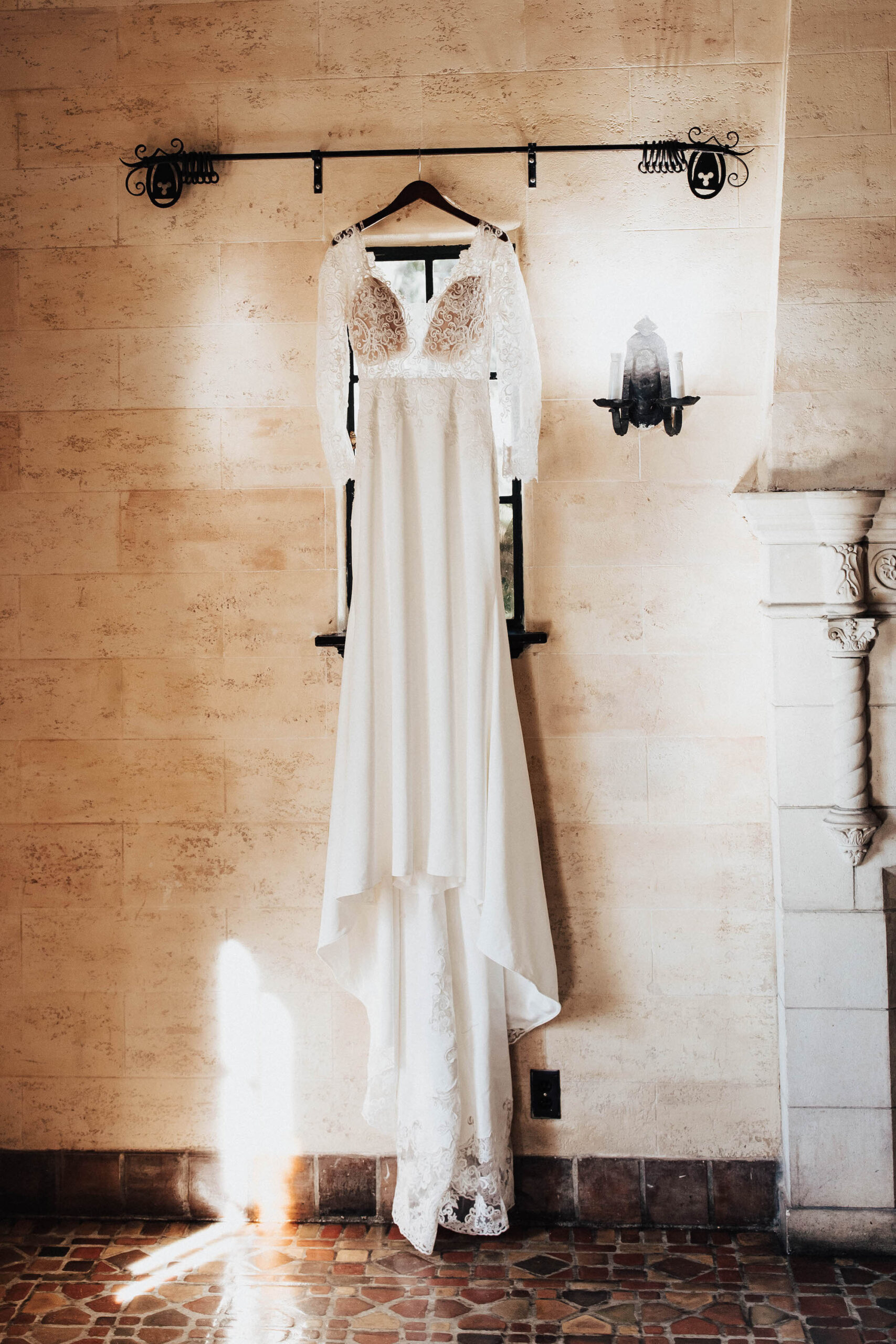 Long Sleeve Lace Detail Wedding Dress Hanging Portrait