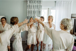 Bride and Bridemaids Getting Ready Wedding Portrait | Cream Satin Robes