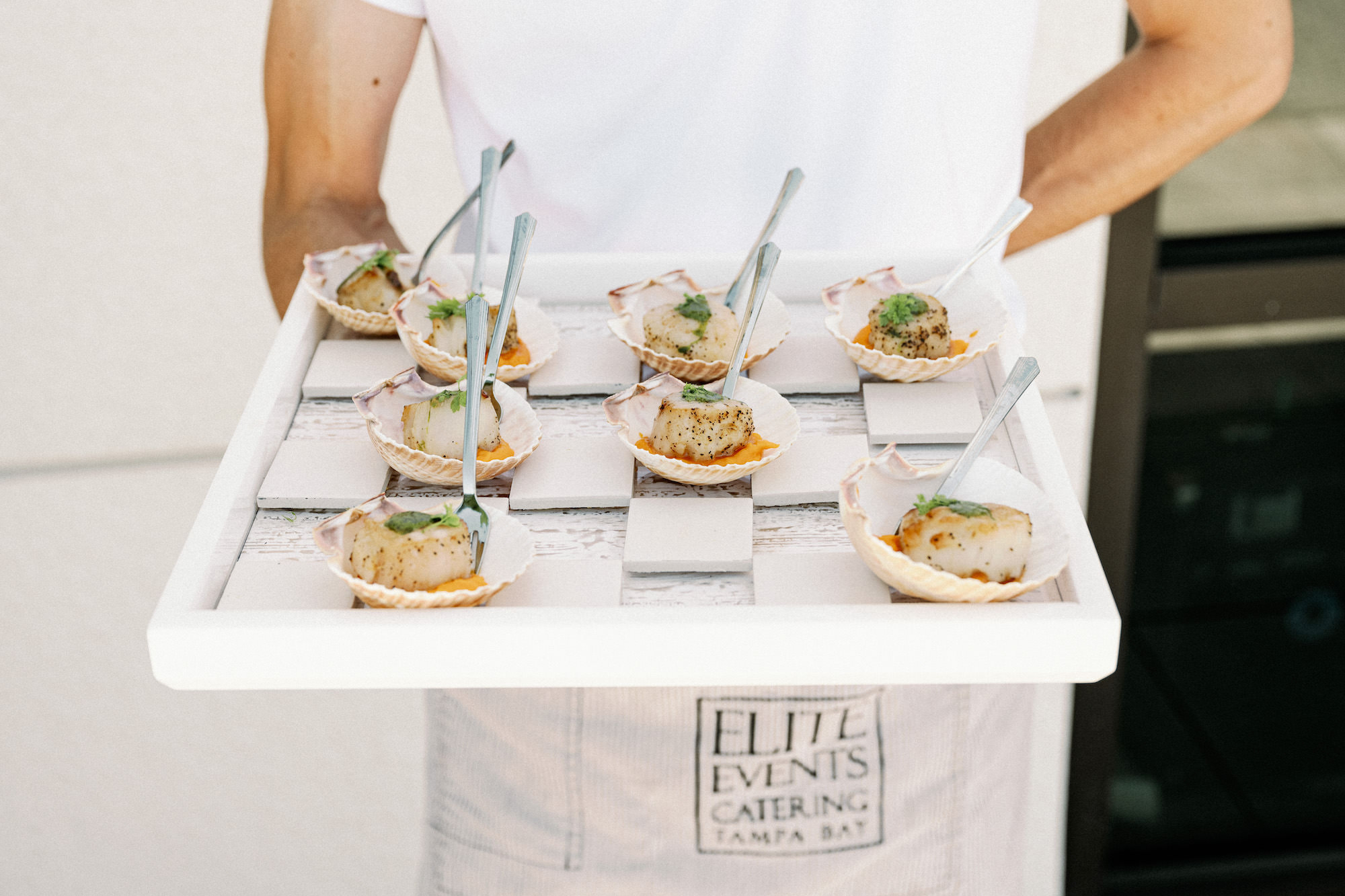 Tampa Bay Catering Company Elite Events Catering | Dewitt for Love Photography | Pan Seared Sea Scallops over Sweet Potato Puree with Herb Oil, served in Scallop Shell