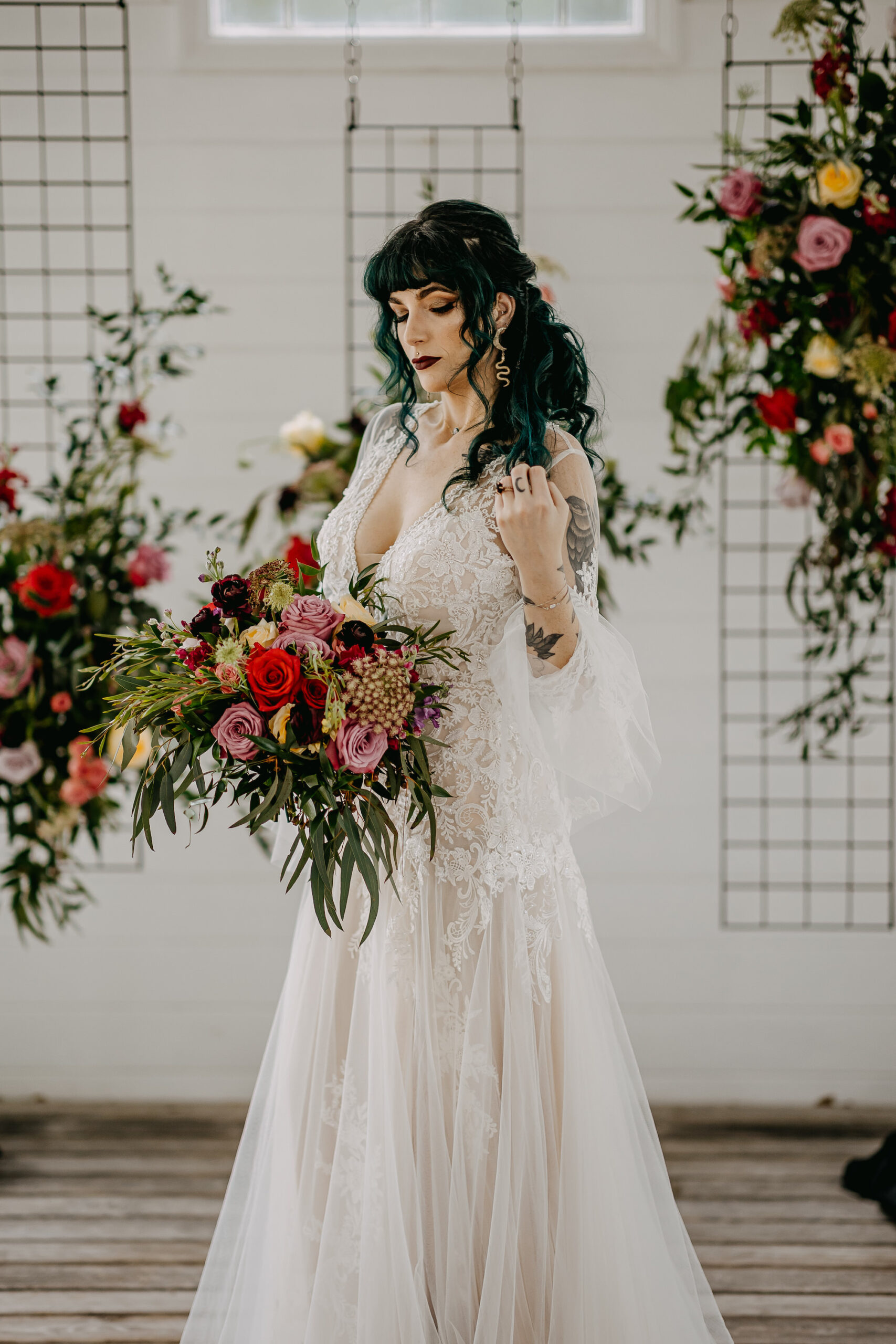 White and Nude Bell Sleeve Lace and Chiffon Mermaid Wedding Dress with Cascading Red, Pink, and Yellow Rose Bridal Bouquet | Tampa Bay Florist Monarch Events and Design | Hair and Makeup Artist Femme Akoi Beauty Studio