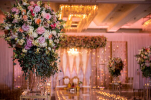 Luxurious Ballroom Wedding Ceremony, Vibrant Floral Arrangement with Blush Pink, Yellow, Coral, and White Flowers, Indian Ceremony Altar, Candlelight Aisle | Hilton Downtown Tampa