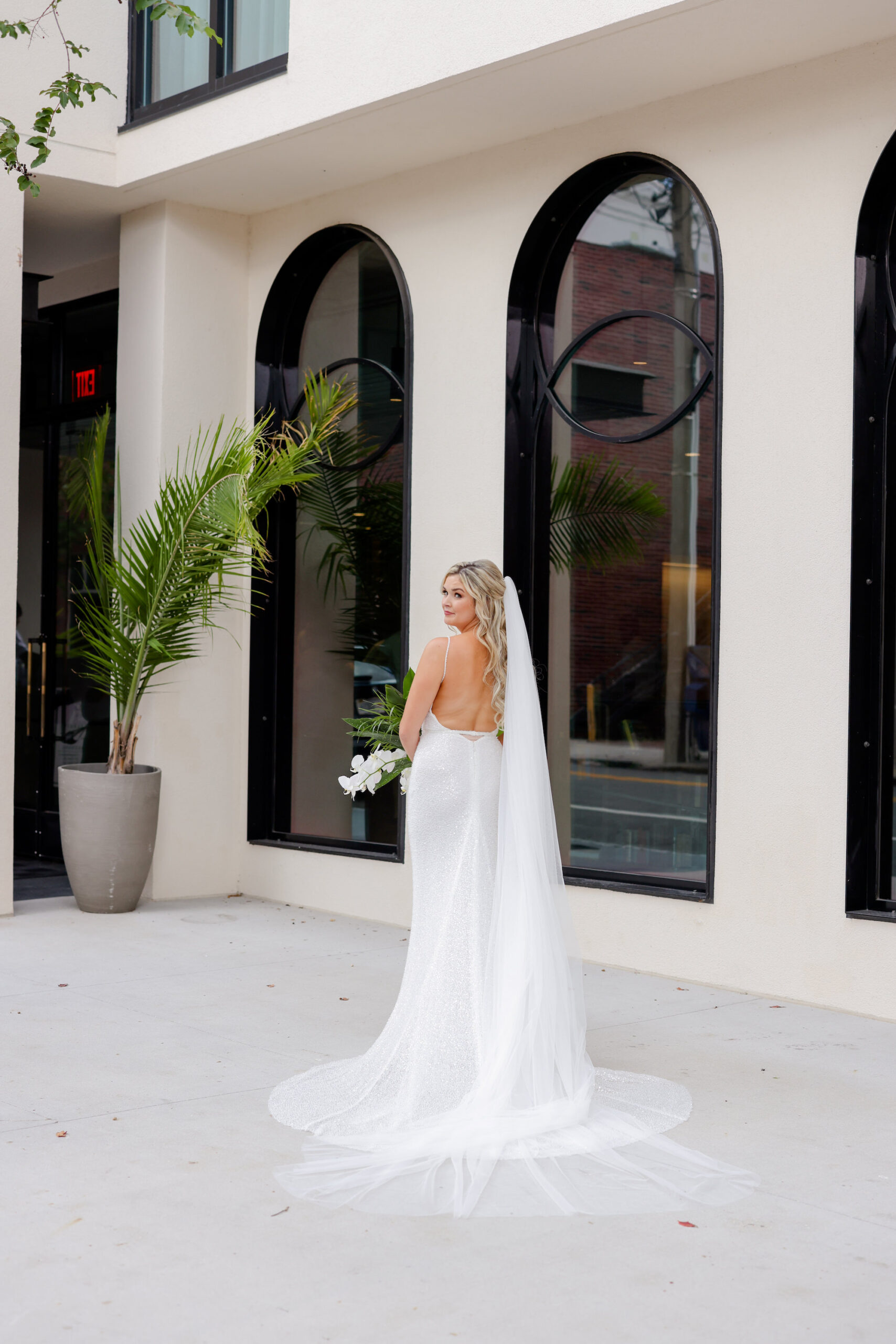 Bride in Backless Fitted Wedding Dress with Cathedral Veil | Tampa Hair and Makeup Artist Femme Akoi