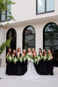 Bride and Bridesmaids in All Black Floor Length Gowns with White and Greenery Bouquets | Lifelong Photography | Bruce Wayne Florals