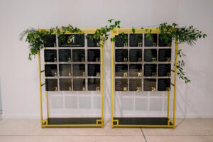 Modern Black Acrylic Wedding Reception Table Seating Chart with Gold Stand and Greenery Inspiration