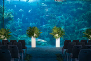 Wedding Ceremony Venue Tampa Florida Aquarium with Greenery Accents | Tampa Florist Bruce Wayne Florals