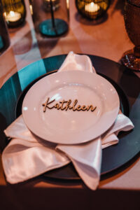 Modern Romantic White Plating with Black Charger Place Setting | White Linen with Custom Laser Cut Wood Name Piece Reception Decor Inspiration