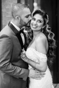 Classic Bride and Groom Black and White, Wearing Modern Off the Shoulder Lace Fitted Wedding Dress, Traditional Henna Tattoo, Long Hollywood Curls | Tampa Bay Wedding Hair and Makeup Artist Michele Renee the Studio