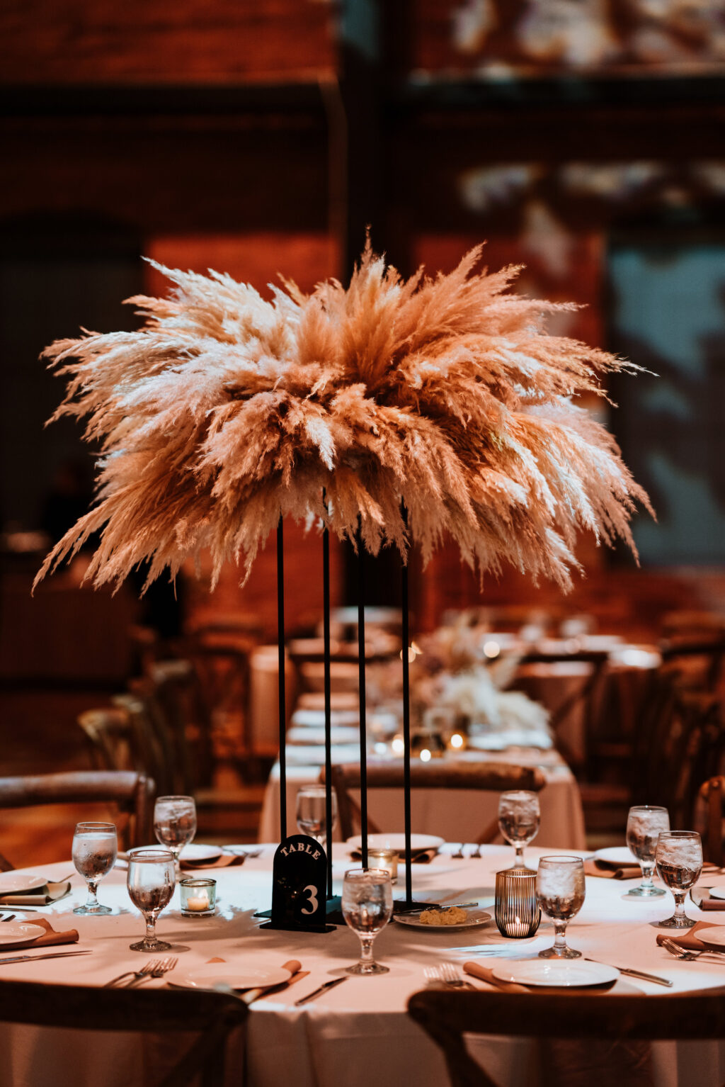 Tall Pampas Centerpiece on Black Stand for Dark and Moody Tablescape Wedding Reception Inspiration