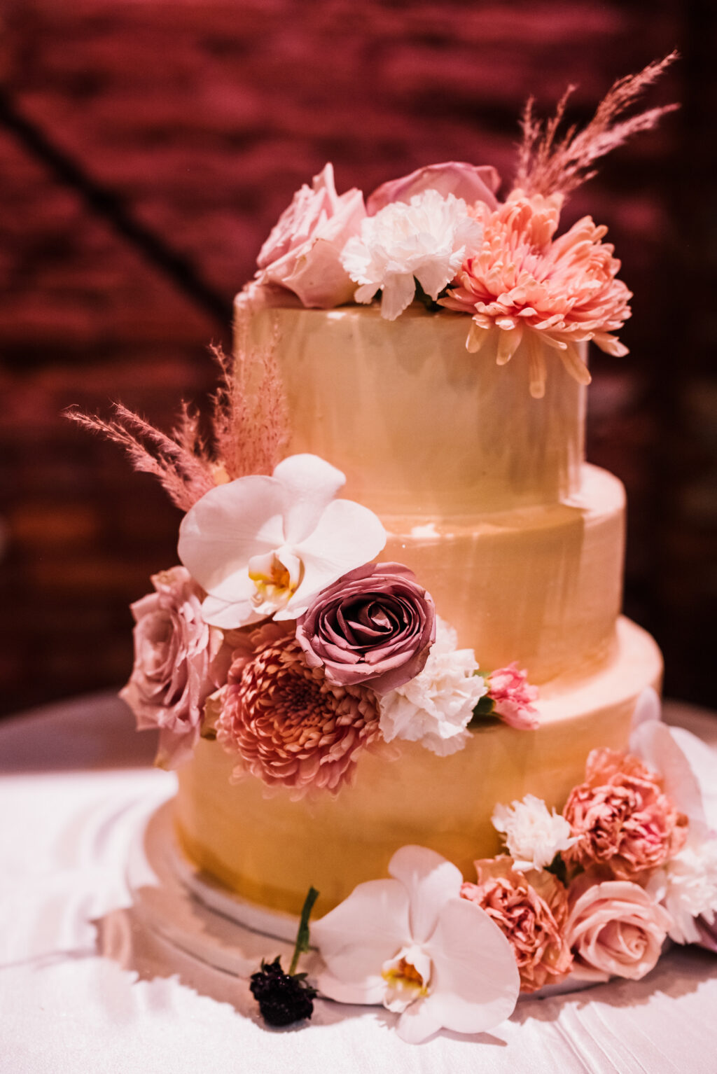 Unique Three Tier Gold Round Wedding Cake with White and Mauve Floral Detailing Inspiration