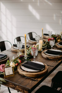 Moody Modern Rustic Wedding Reception Ideas | Tablescape with Flameless Candles and Long Floral Greenery and Rose Centerpieces | Tampa Bay Wedding Florist Monarch Events and Design