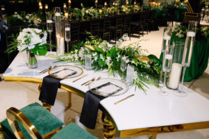 Modern Sweetheart Table with Tropical Tabletop Floral Arrangement and Floating Candles | Black Napkins | Louis Pop Chair and Velvet Seating Inspiration | Tampa Bay Florist FH Events | Rentals A Chair Affair