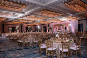 Modern Luxurious Ballroom Wedding Reception, Pink Draping, Round Tables with Rose Gold Linens and Chiavari Chair, Tall Floral Centerpieces| Florida Wedding Venue Hilton Downtown Tampa