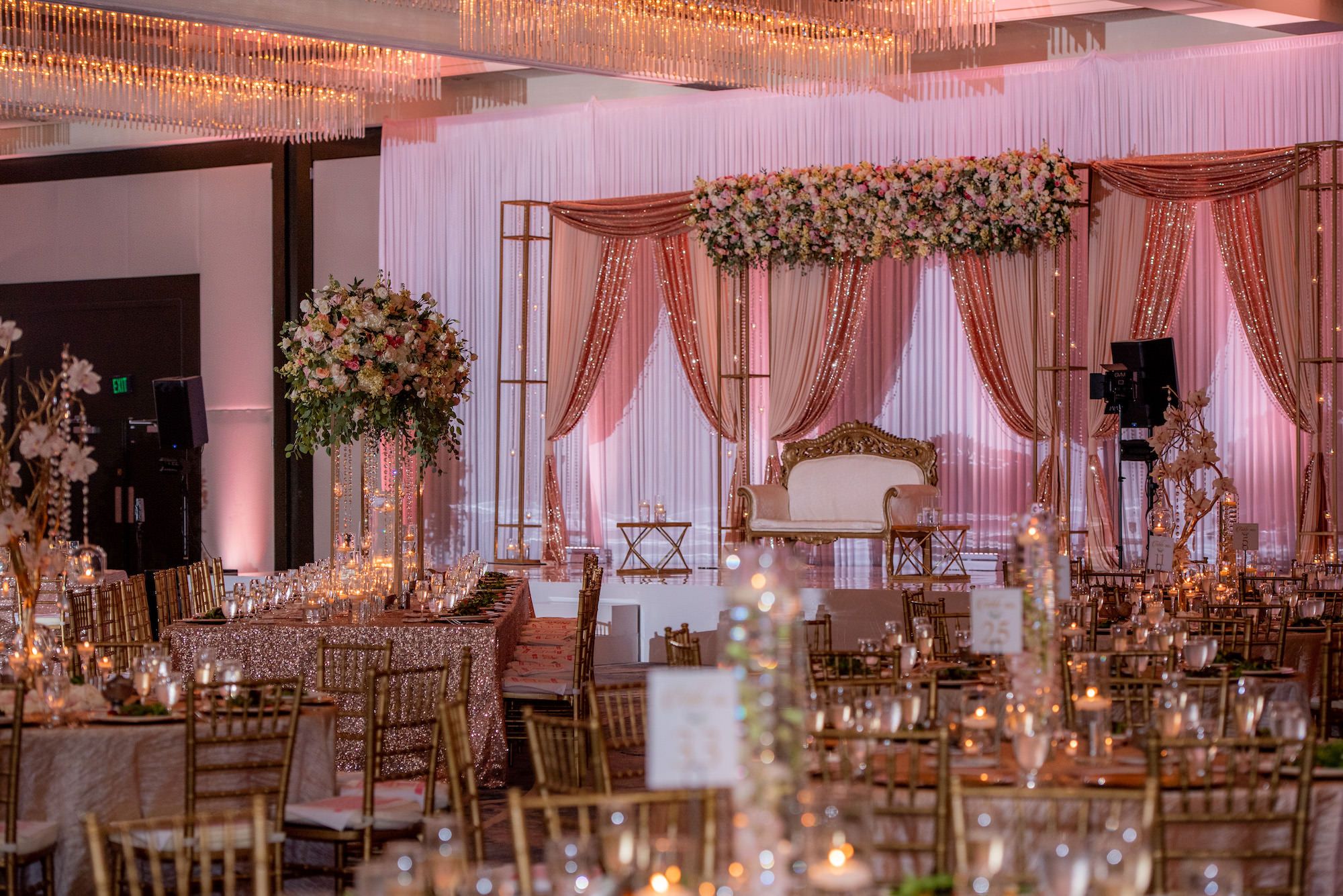 Modern Luxurious Ballroom Wedding Reception, Pink Draping, Mandap with Sweetheart Satee, Round Tables with Rose Gold Linens and Chiavari Chair, Tall Floral Centerpieces| Florida Wedding Venue Hilton Downtown Tampa