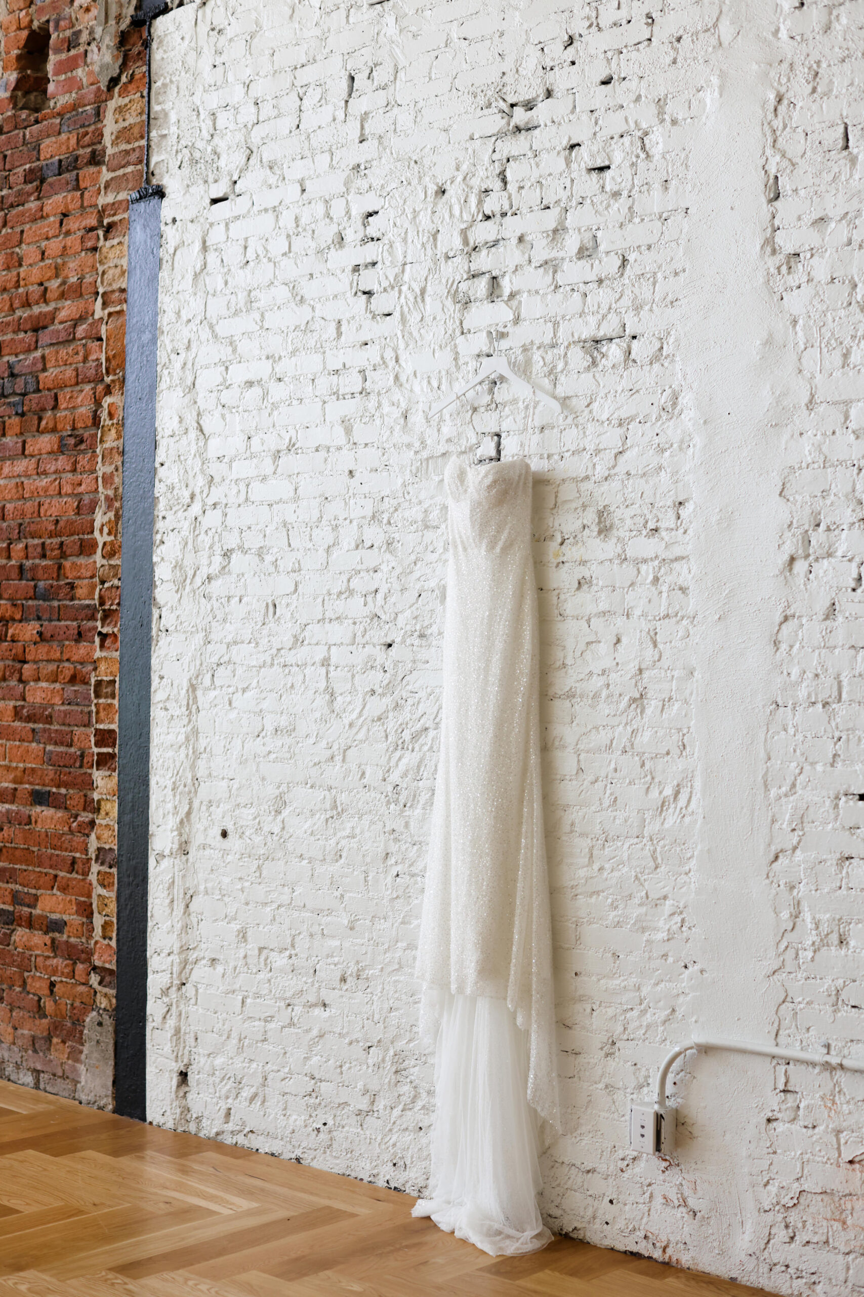 Wedding Dress Hanging on White Brick Wall Wedding Portrait | Tampa Florida Photographer Lifelong Photography