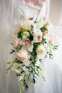 Traditional Cascading Bridal Wedding Bouquet with Blush Pink Roses, Stock Flowers, White Orchids, and Greenery Inspiration