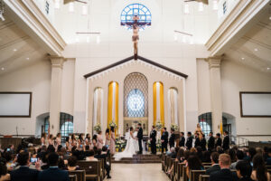 Bride and Groom Exchange Vows in Church Wedding Ceremony Wedding Portrait