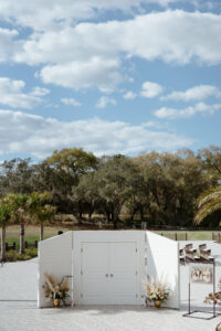Outdoor Ceremony with White Door Entrance | Tampa Bay Wedding Venue Simpson Lakes